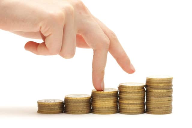 Hand and money staircase isolated on white